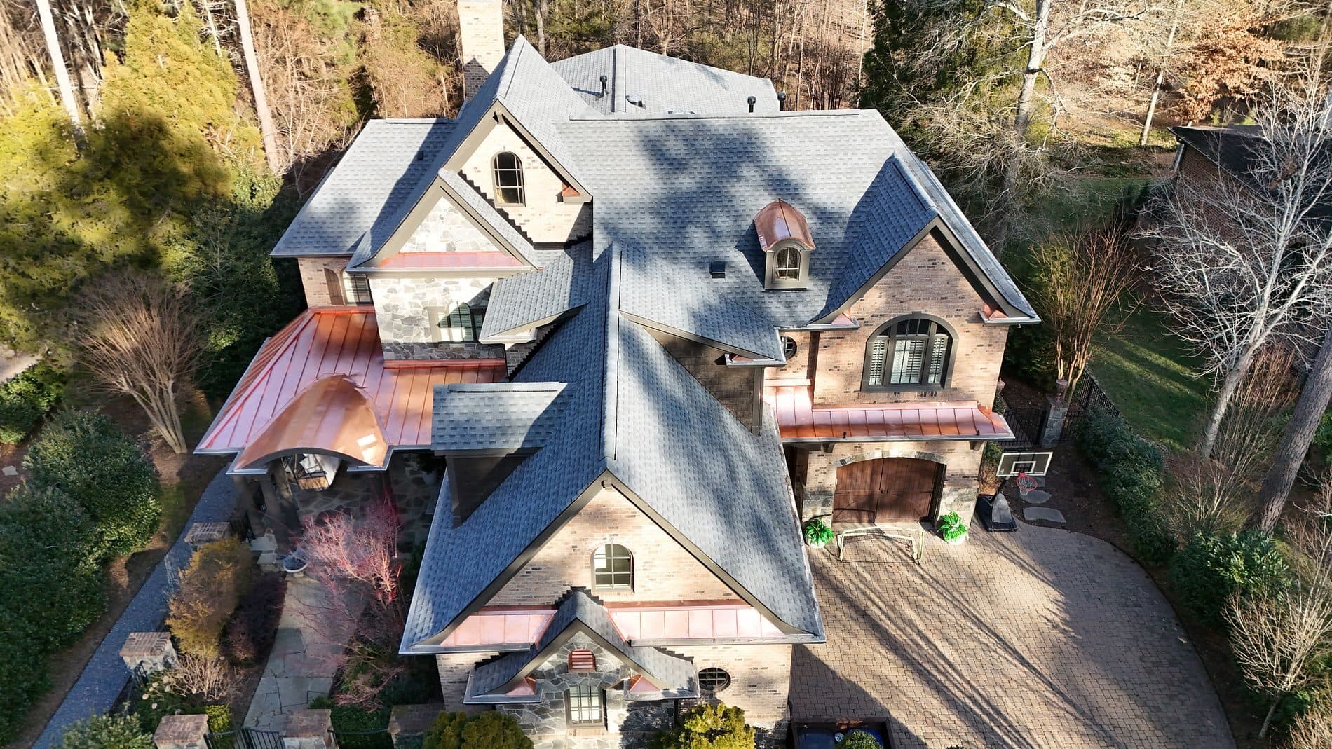 Estate roof with copper accents — after