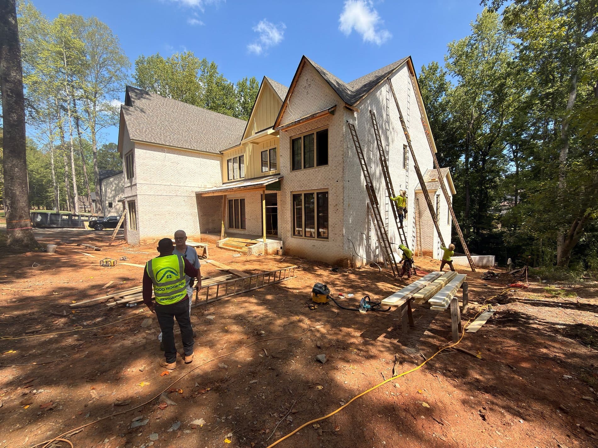 Good Roofing crew framing a new home addition